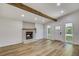 Spacious living room with a fireplace and large windows for natural light at 2572 Bates Se St, Smyrna, GA 30080