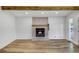 Bright living room with hardwood floors and a cozy fireplace for cozy nights at home at 2572 Bates Se St, Smyrna, GA 30080