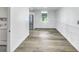 Open-concept room featuring wood floors and white wainscoting and large window at 2572 Bates Se St, Smyrna, GA 30080