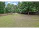 Large backyard with a wood fence at 2988 Belfaire Lake Dr, Dacula, GA 30019