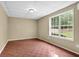 Finished basement featuring a large window and tile flooring at 2988 Belfaire Lake Dr, Dacula, GA 30019