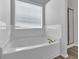 Bright bathroom featuring a tub and shower combo at 2988 Belfaire Lake Dr, Dacula, GA 30019