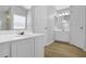 Bathroom featuring a tub, shower, modern vanity, and a door into the room at 2988 Belfaire Lake Dr, Dacula, GA 30019