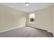 Comfortable bedroom features plush carpeting, light walls, and lots of natural light at 2988 Belfaire Lake Dr, Dacula, GA 30019