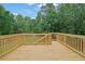 Wooden deck with stairs down to the yard at 2988 Belfaire Lake Dr, Dacula, GA 30019