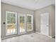 Bright dining space featuring access to a deck, large windows, and neutral wall color at 2988 Belfaire Lake Dr, Dacula, GA 30019