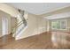 A sprawling staircase welcomes you into the bright entryway with views to the outside at 2988 Belfaire Lake Dr, Dacula, GA 30019
