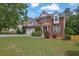 Beautiful brick home with manicured lawn, two-car garage, and lovely landscaping at 2988 Belfaire Lake Dr, Dacula, GA 30019