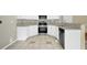 Well-equipped kitchen with stainless steel appliances, granite countertops, and white cabinetry at 2988 Belfaire Lake Dr, Dacula, GA 30019