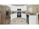 Modern kitchen with white cabinets, stainless steel appliances, and granite countertops at 2988 Belfaire Lake Dr, Dacula, GA 30019