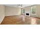 Spacious living room boasts hardwood floors, fireplace, and ample natural light at 2988 Belfaire Lake Dr, Dacula, GA 30019