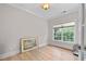 Bedroom with hardwood floors, neutral paint, baseboard trim, and lots of natural light at 3519 Preserve Se Dr, Atlanta, GA 30339