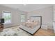 Light bedroom with hardwood floors, with bed and a big windows at 3519 Preserve Se Dr, Atlanta, GA 30339