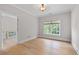 Finished bedroom featuring hardwood floors, crown molding, neutral paint, and lots of natural light at 3519 Preserve Se Dr, Atlanta, GA 30339