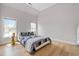 Bright bedroom featuring hardwood floors, neutral walls, and two sunny windows at 3519 Preserve Se Dr, Atlanta, GA 30339