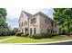 Brick home with a manicured lawn, dark shutters, and beautiful, mature trees and bushes at 3519 Preserve Se Dr, Atlanta, GA 30339