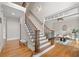 Grand foyer with hardwood floors, staircase with iron spindles, and open view to living area at 3519 Preserve Se Dr, Atlanta, GA 30339