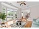 Bright living room features hardwood floors, large bay windows, and seamless flow to foyer at 3519 Preserve Se Dr, Atlanta, GA 30339