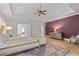 Spacious main bedroom features trey ceiling, hardwood floors, area rug, and a sitting area with lots of natural light at 3519 Preserve Se Dr, Atlanta, GA 30339