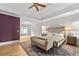 Main bedroom features trey ceilings, hardwood floors, neutral paint, area rug, and sitting area at 3519 Preserve Se Dr, Atlanta, GA 30339
