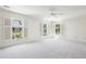 Bright bedroom with plush carpet, ceiling fan and three shuttered windows at 51 Ivy Chase Ne, Atlanta, GA 30342