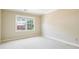 Neutral bedroom with a window bringing in natural light, and neutral carpet at 51 Ivy Chase Ne, Atlanta, GA 30342