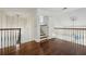 Bright hallway with hardwood floors, decorative ceiling medallions, and staircase leading to another level at 51 Ivy Chase Ne, Atlanta, GA 30342