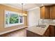 Charming kitchen nook with a bay window, granite countertops, and stainless steel sink at 51 Ivy Chase Ne, Atlanta, GA 30342