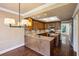 Beautiful kitchen with granite countertops, stainless steel appliances, and a stylish lighting fixture at 51 Ivy Chase Ne, Atlanta, GA 30342