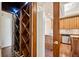 Butlers pantry with wine storage, granite counters and oak cabinetry, with stainless steel appliances at 51 Ivy Chase Ne, Atlanta, GA 30342