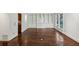 Open room featuring hardwood floors, a window and custom built in shelving at 51 Ivy Chase Ne, Atlanta, GA 30342