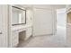 Bright main bedroom featuring a vanity area, closet, and access to the main bathroom at 51 Ivy Chase Ne, Atlanta, GA 30342