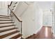 Traditional staircase with wood steps and wrought iron railing, leading to the upper level at 51 Ivy Chase Ne, Atlanta, GA 30342