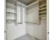 Well-organized walk-in closet with built-in shelving and hanging rods at 51 Ivy Chase Ne, Atlanta, GA 30342