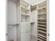 Spacious walk-in closet featuring custom shelving and ample storage at 51 Ivy Chase Ne, Atlanta, GA 30342