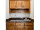 Conveniently placed wet bar featuring upper cabinets, lower drawers, sink and counter at 51 Ivy Chase Ne, Atlanta, GA 30342