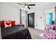 Bedroom featuring a ceiling fan and neutral decor at 7994 Devonshire Dr, Jonesboro, GA 30238