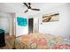 Spacious bedroom featuring a cozy bed, wood-look floors, recessed lighting and artwork at 7994 Devonshire Dr, Jonesboro, GA 30238