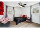 Bedroom showcasing a ceiling fan and natural light at 7994 Devonshire Dr, Jonesboro, GA 30238