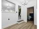 Bright hallway with recessed lighting and views to the kitchen and living area, enhancing the open feel at 7994 Devonshire Dr, Jonesboro, GA 30238
