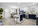 Modern kitchen with granite countertops, updated appliances, and adjacent dining area at 7994 Devonshire Dr, Jonesboro, GA 30238
