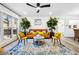 Bright and open living room featuring modern decor, plants, and hardwood floors at 7994 Devonshire Dr, Jonesboro, GA 30238