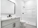 Modern bathroom featuring a new vanity, sink, and shower at 110 Northwood Creek Way, Oxford, GA 30054
