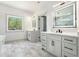Bright bathroom showcasing double vanity, quartz countertops, and sleek mirrors at 110 Northwood Creek Way, Oxford, GA 30054