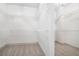 Spacious walk-in closet with ample shelving for optimal storage and organization at 110 Northwood Creek Way, Oxford, GA 30054