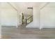 Light filled entryway with light gray floors and staircase to upper level at 110 Northwood Creek Way, Oxford, GA 30054