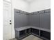 Mudroom with built in bench, coat hooks and storage area at 110 Northwood Creek Way, Oxford, GA 30054