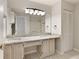 Bathroom featuring double sinks, granite countertops, large mirror, closet and shower at 1450 Keys Crossing Ne Dr, Brookhaven, GA 30319
