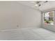Bright bedroom with plush carpet, a large window, and neutral walls perfect for a relaxing retreat at 1450 Keys Crossing Ne Dr, Brookhaven, GA 30319