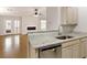 Open-concept kitchen with granite countertops, stainless steel appliances, and view into the living room at 1450 Keys Crossing Ne Dr, Brookhaven, GA 30319
